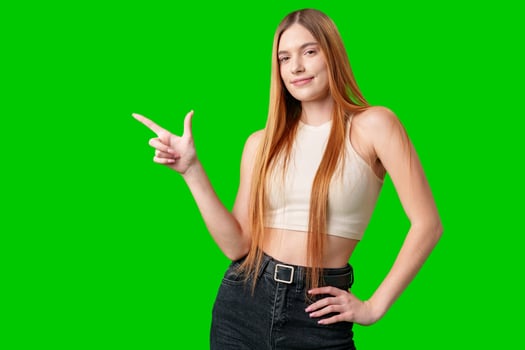 Young Woman With Long Hair Pointing To Copy Space photo
