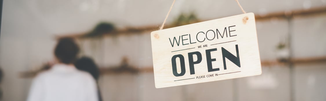 wooden Open sign hangs at the cafe's or restaurant's entrance. photo