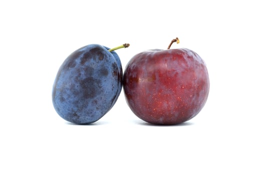 Fresh plums on a white background, highlighting vibrant natural colors photo