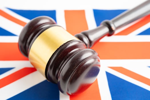 United Kingdom for judge lawyer and US dollar banknotes on USA America flag, finance concept. photo
