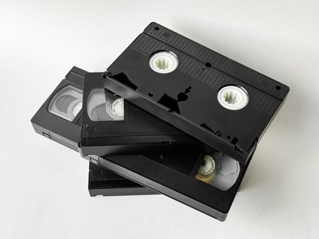 Retro vhs tapes on white background for nostalgic media themes photo
