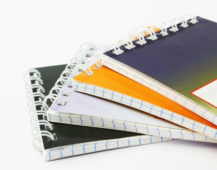 stack of ring binder book photo