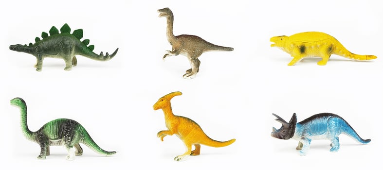 Toy dinosaurs on white photo