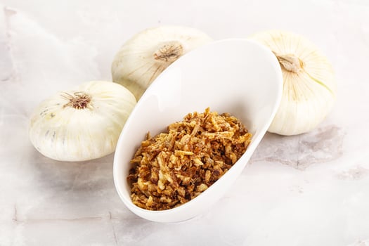 Dried roasted onion flakes for culinary photo