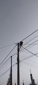 A view of a city street with power lines and telephone poles photo