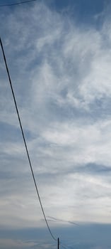 A lone red kite flying in the sky photo