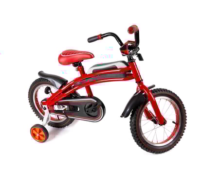 red bicycle on white photo