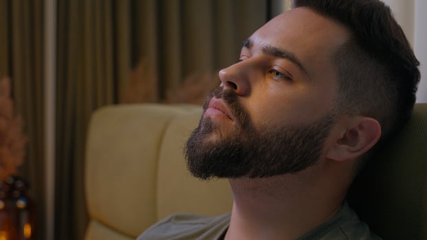 Caucasian man rubbing forehead head male problems worried stress overworked emotion fear guilt disappointment defeat distraught solitude failure regret frustration exhaustion guy bed bedroom crisis photo