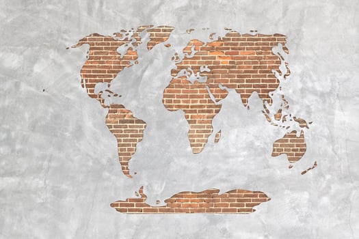 World map on antique brick wall texture background. photo