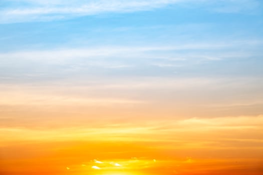 Beautiful , luxury soft gradient orange gold clouds and sunlight on the blue sky perfect for the background, take in everning,Twilight, Large size, high definition landscape photo
