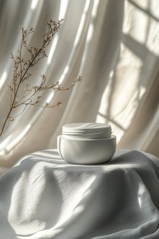 Delicate skincare cream jar surrounded by blooming pink flowers in soft light setting photo