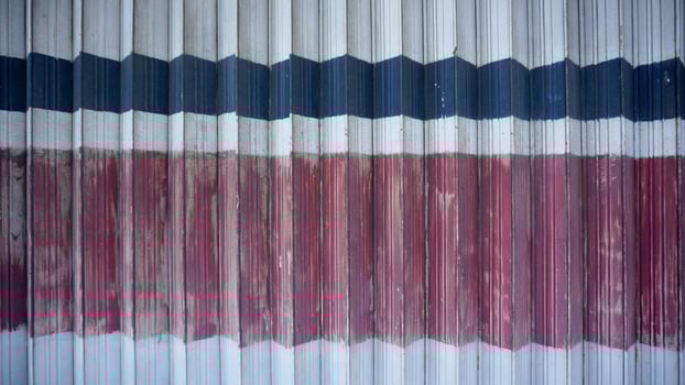 Abstract background of red and blue stripes on a metal wall. photo