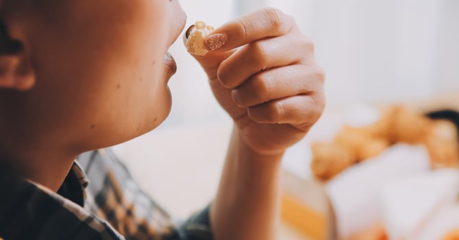 A woman holding a bowl of popcorn photo