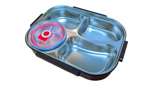 A top-down view of a stainless steel lunch box with multiple compartments. The box is made of high-quality SUS304 food-grade stainless steel, making it durable, hygienic, and eco-friendly. photo