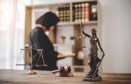 Lady Justice Holding Scales of Law in a Courtroom - Symbolizing Equality, Fairness, and Legal Proceedings photo