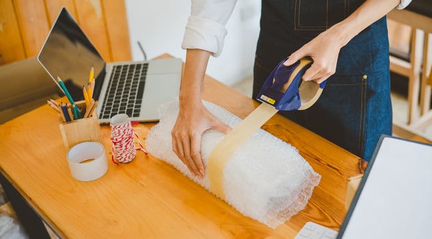 Online small business owners are packing their ordered products into the boxes for their customers based on the concept of online shopping - online shopping. photo