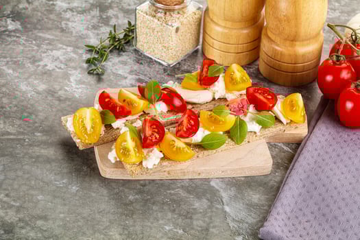 Grain bread with tomato and cream cheese photo