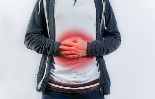 Person with digestive and stomach problems isolated. Unhappy man with digestive problems isolated photo