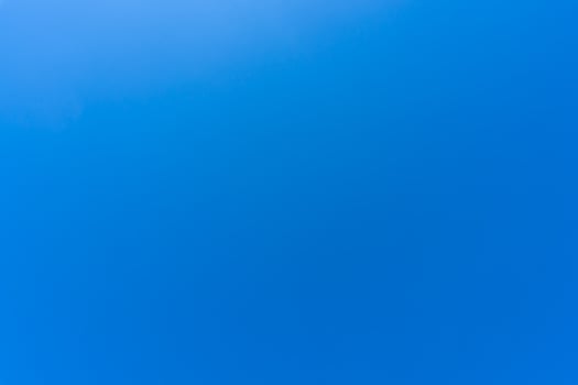 Beautiful blue sky without clouds in the morning or evening used as natural background texture in decorative art work photo