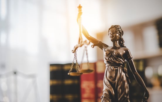 Lady Justice Holding Scales of Law in a Courtroom - Symbolizing Equality, Fairness, and Legal Proceedings photo