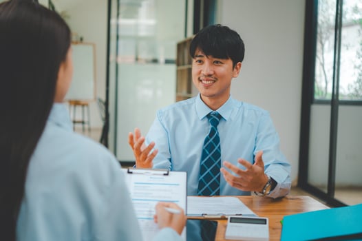 Job applicant introducing himself For a job interview after submitting a resume document to the Human Resources Manager for consideration for employment in the company. photo