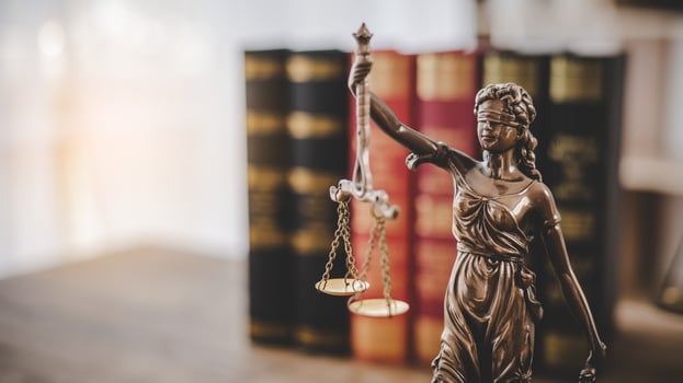 Lady Justice Holding Scales of Law in a Courtroom - Symbolizing Equality, Fairness, and Legal Proceedings photo