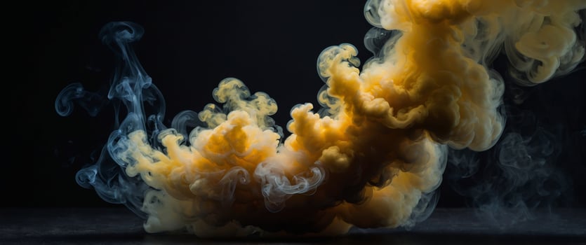 A yellow cloud of smoke on a black background. photo