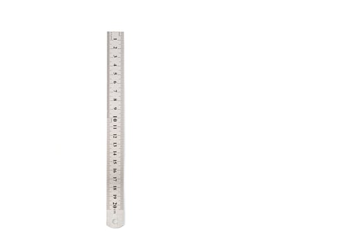 metal ruler isolated on white background photo