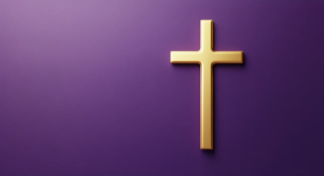 A golden cross on a rich purple background symbolizing faith and spirituality photo