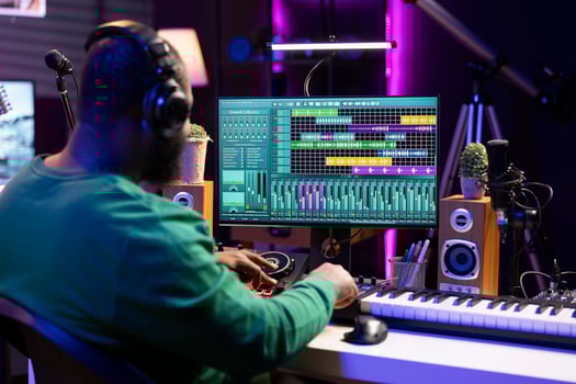 Tracking engineer enhancing sound quality on his audio recordings, editing with mixing and mastering techniques by using a stereo console in home studio. Skilled technician adding special effects. photo