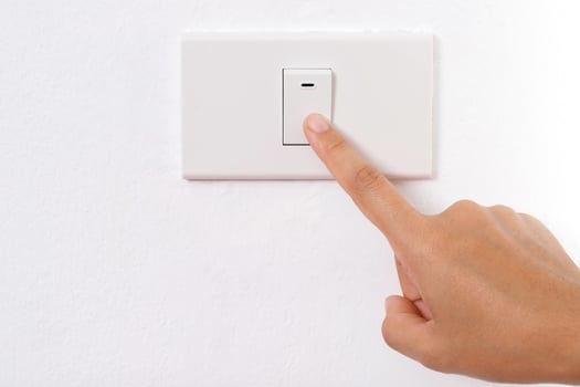 Turn on-off the light switch. to save electricity photo