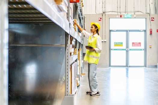 Portrait of asian woman warehouse worker in uniform checks stock and inventory with digital tablet computer, working in delivery, distribution center, logistic and business export photo