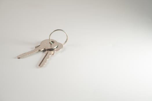 A key ring with two keys on a white background photo
