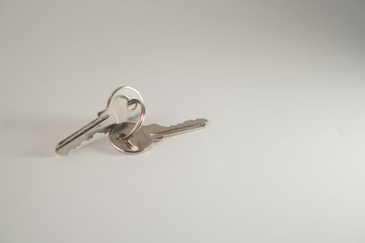 Two keys on a white background photo