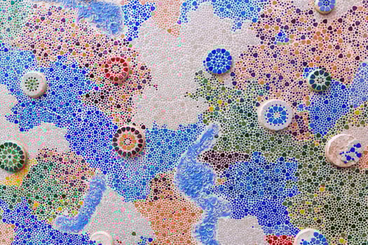 a pattern of colorful tiles and beads. photo