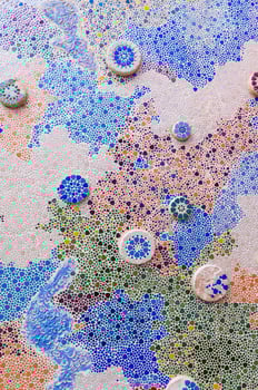 a pattern of colorful tiles and beads. photo
