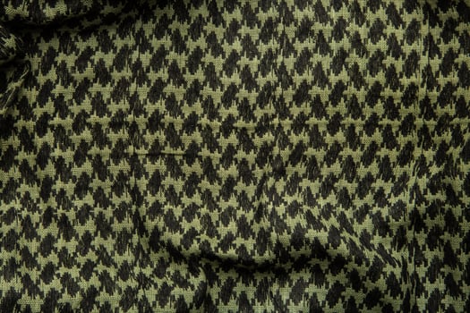 Keffieh scarf. The texture of the cotton traditional symbolic arabian scarf. Khaki back. photo