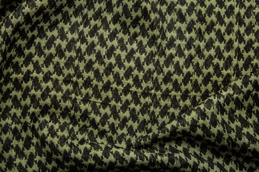 Keffieh scarf. The texture of the cotton traditional symbolic arabian scarf. Khaki back. photo