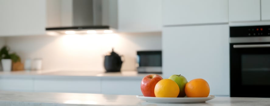 A bowl of fruit on the counter in the kitchen photo