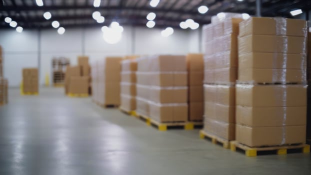 A warehouse full of boxes and pallets photo