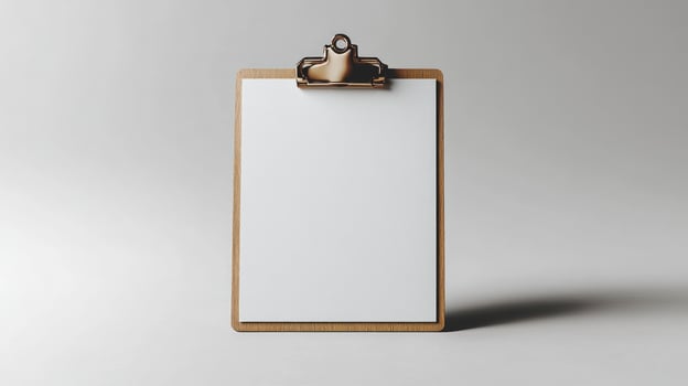 A blank clipboard awaits your thoughts and ideas in gentle morning light photo
