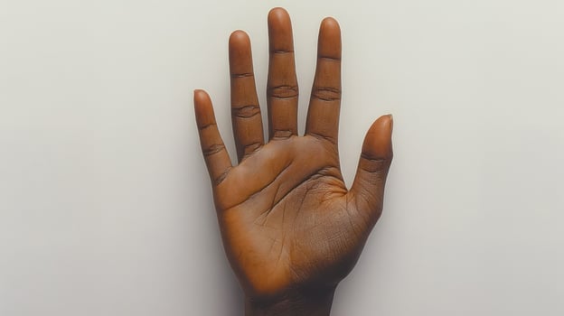 A hand rests calmly with fingers extended, showcasing its natural beauty photo