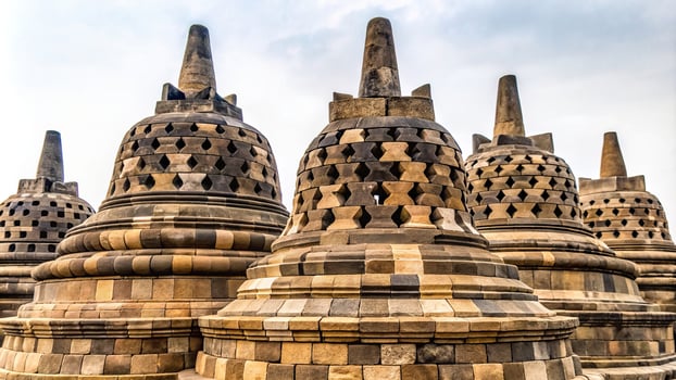 Stupa of Borobudur isolated on white background Extreme Close Up, wonder of the world, symbolic, pilgrimage site, UNESCO World Heritage Site, ancient, Southeast Asia, spirituality photo