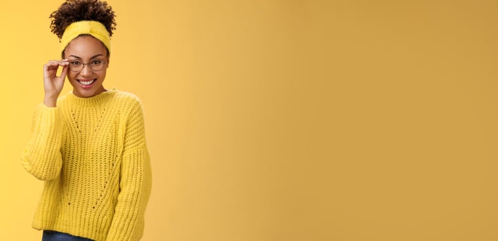 Attractive friendly charismatic female programmer frontend developer smiling broadly check glasses nose look confident lucky have excellent idea improve app workability, standing yellow background photo
