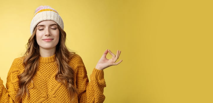Keep calm carry on. Portrait relieved happy meditating charming young woman learn control feelings breething yoga practice smiling delighted relaxed close eyes hands sideways zen nirvana gesture photo