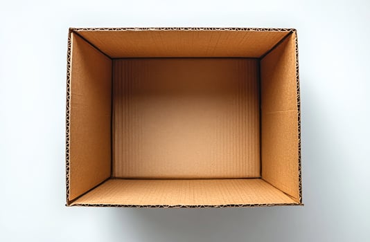 A cardboard box is empty and sits on a white background. The box is brown and has a simple design photo