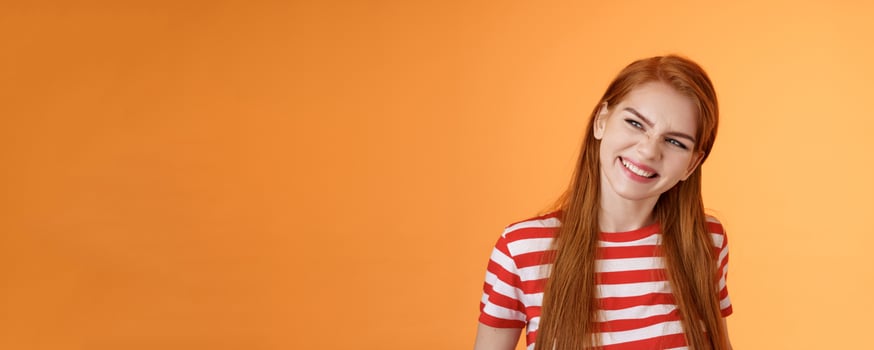 Sassy confident redhead daring girl have perfect summer plans, vacation ideas, inspired create something awesome, wrinkle nose excited, smiling satisfied look left assured, satisfied expression photo