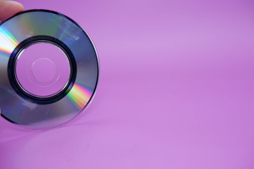 a compact disc isolated on purple background photo