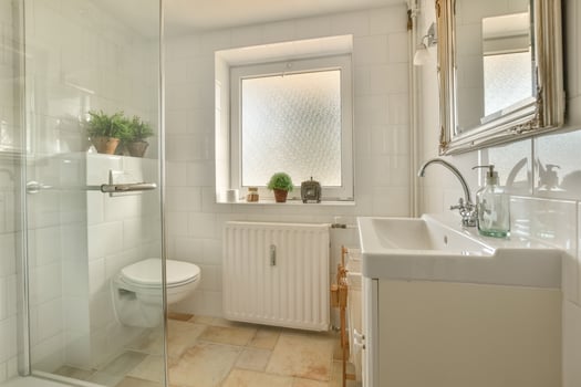 A bathroom with a shower, toilet and sink photo