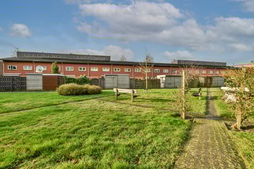 A grassy area with a bench photo